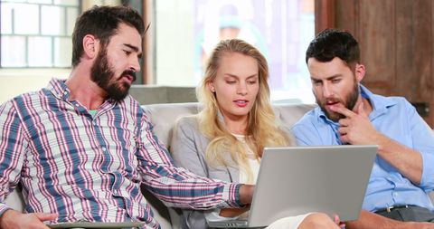 Diverse Team Collaborating on Laptop in Creative Office Space - Download Free Stock Images Pikwizard.com