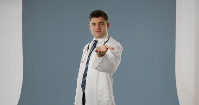 Confident Doctor Reaching Out Hand in Medical Office - Download Free Stock Images Pikwizard.com