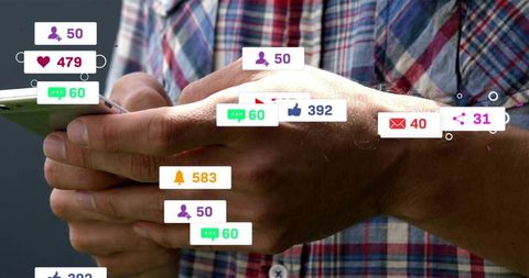 Man tapping smartphone with floating social media notifications and engagement badges
