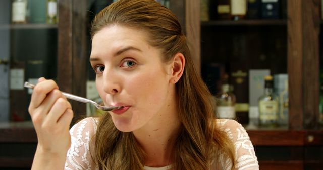 Woman Enjoying Meal in Rustic Kitchen - Download Free Stock Images Pikwizard.com