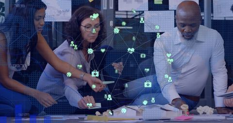 Diverse team brainstorming with digital network graphics