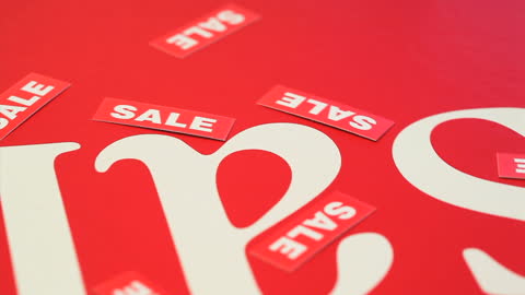 Red Sale Sign with White Text and Tag Elements