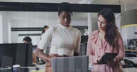 Diverse Colleagues Collaborating in Modern Office with Digital Financial Interface