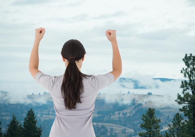 Woman Raising Arms on Mountain Top Celebrating Achievement - Download Free Stock Photos Pikwizard.com
