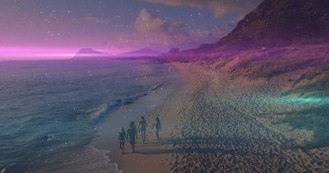 Friends walking barefoot along twilight beach leaving footprints on wet sand at starry dusk
