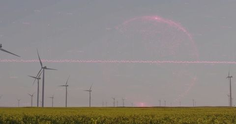 Wind Turbines Rotating over Canola Field with Pink Digital Halo and Muted Horizon
