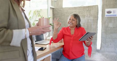 Senior executive engaged in productive office discussion with team