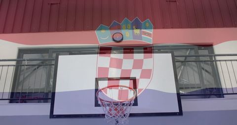 Croatian flag blended with modern indoor basketball court symbolizing sports unity