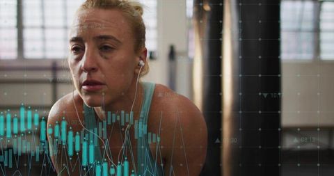 Focused athlete breathing heavily after intense workout with performance analytics overlay