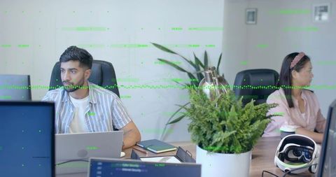 Teamwork in innovative office setting with vr headset and technology