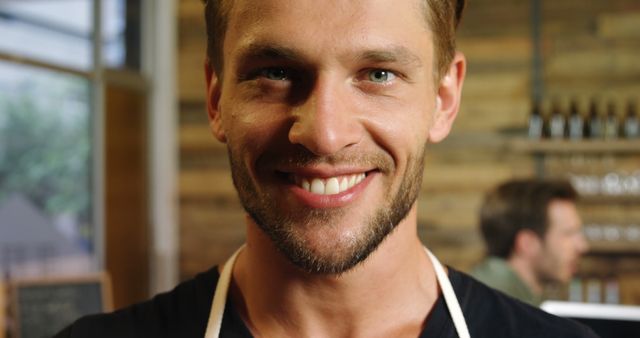 Smiling Cafe Worker with Apron in Coffee Shop - Download Free Stock Images Pikwizard.com