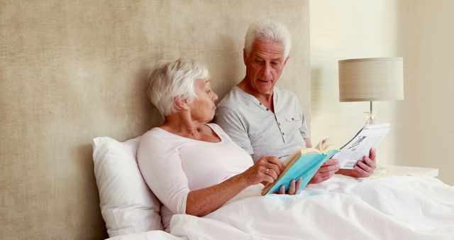 Senior Couple Relaxing in Bed Reading Books - Download Free Stock Images Pikwizard.com