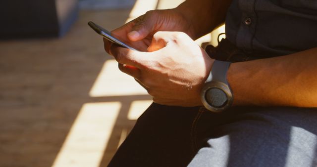 Close-up of Person Using Smartphone in Sunlit Room - Download Free Stock Images Pikwizard.com