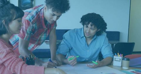 Diverse Team Collaborating on Creative Project with Sketch Plans