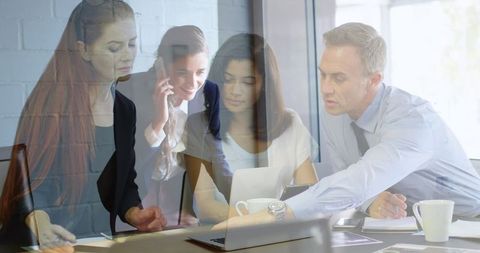 Overlay of Busy Business Environment with Focused Professionals