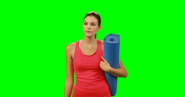 Fit woman touching invisible screen against green screen - Download Free Stock Photos Pikwizard.com
