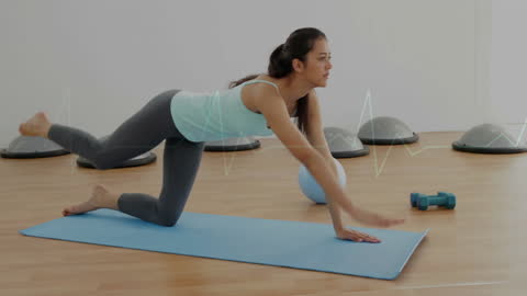 Woman Practicing Pilates with Heartbeat Overlay in Fitness Studio