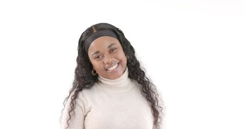Confident Smiling Woman Posing Against White Background