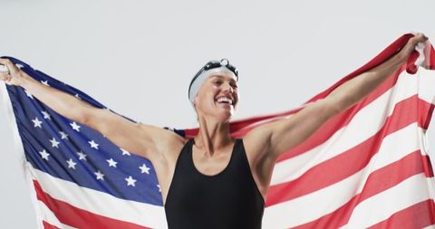 Exultant Female Swimmer Celebrating with American Flag