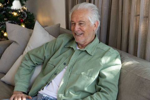 Senior Man Relaxing at Home During Festive Season