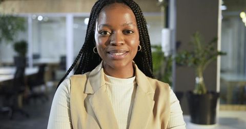 African american business leader headshot showing confidence in modern office environment