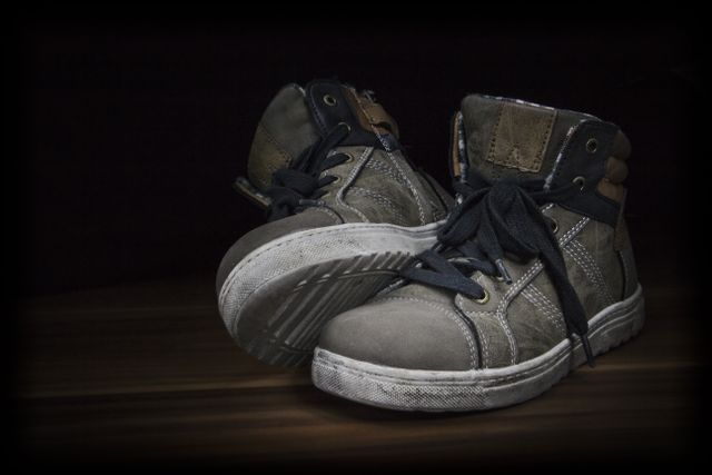 Worn Casual High-Top Sneakers on Dark Background - Download Free Stock Photos Pikwizard.com