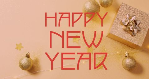 Golden Festive New Year Greeting with Baubles and Gift
