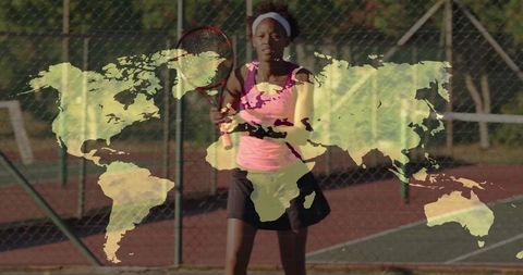 Athletic woman excelling in tennis on fenced outdoor court