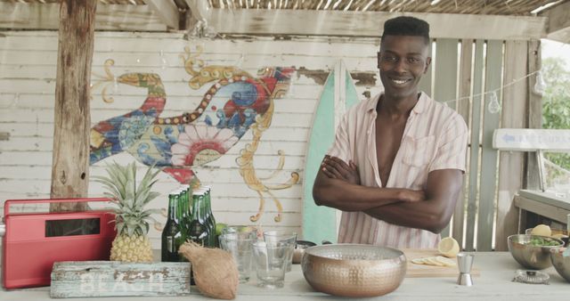 Young man preparing tropical drinks at outdoor beach bar - Download Free Stock Images Pikwizard.com