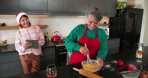 Mother and Daughter Baking Together During Holiday Season