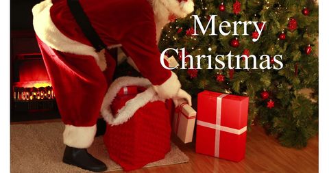 Santa Delivering Presents Under Christmas Tree