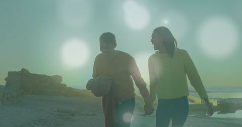 Happy Couple Strolling Along Scenic Beach During Sunset - Download Free Stock Images Pikwizard.com