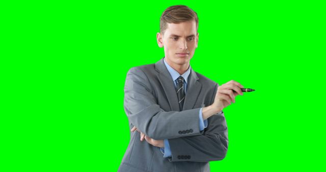 Businessman Holding Marker on Green Screen Background, Making Presentation - Download Free Stock Images Pikwizard.com