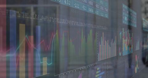 Colorful charts display on trading office glass panel