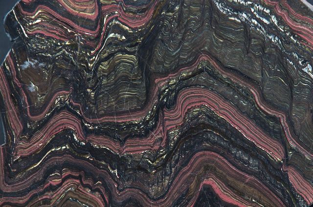 This close-up view of a section of Morison stromatolite reveals intricate patterns and textures created by microbial mats. The detailed stratification and colorful layers can be used for educational materials on geology, presentations, science textbooks, or as visually interesting artwork for specialists and enthusiasts of geosciences.