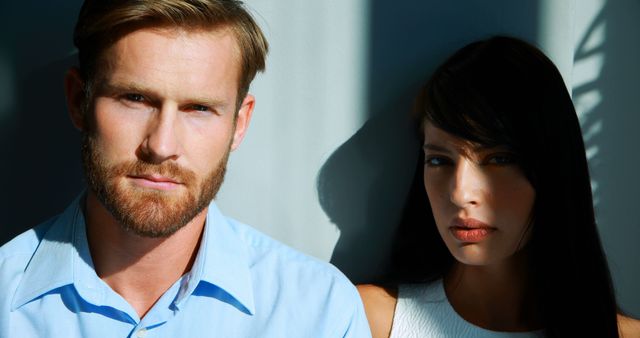 A dramatic portrait captures a contemplative or tense mood between a man and woman. - Download Free Stock Photos Pikwizard.com