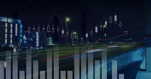 Financial graphs and city skyline at night