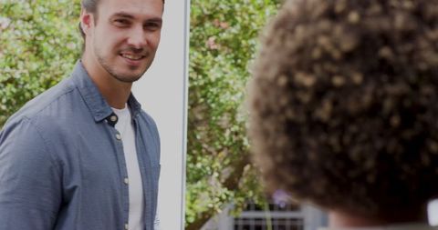 Couple Engaging in Heartfelt Outdoor Conversation Amid Greenery