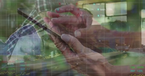 Senior Using Smartphone Overlapping Stock Market Tickers in Office