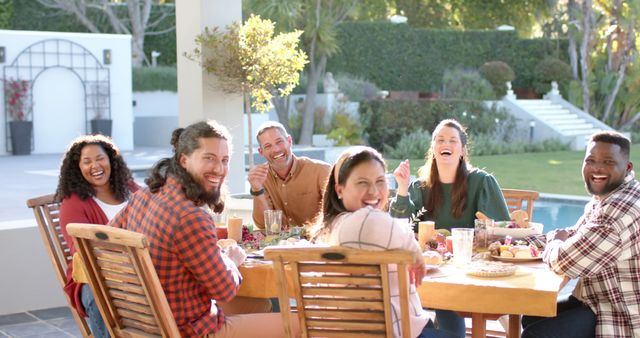 Diverse Group of Friends Enjoying Outdoor Meal Together in Backyard - Download Free Stock Images Pikwizard.com