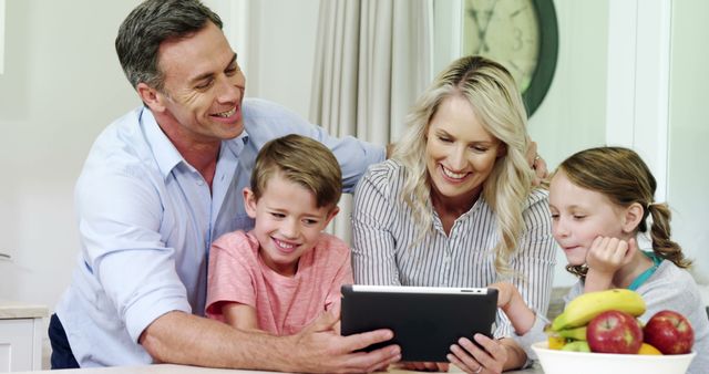 Happy Family Enjoying Together Time with Tablet in Kitchen - Download Free Stock Images Pikwizard.com