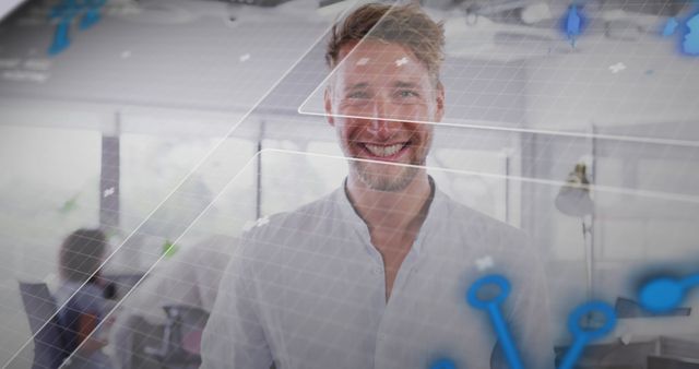 Smiling professional man in a modern office environment with a digital interface overlay. Highlights use of technology in contemporary business settings. Ideal for technology startups, business consulting, and innovation themed content.