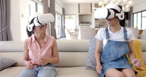 Happy Teenage Girls Enjoying Virtual Reality at Home