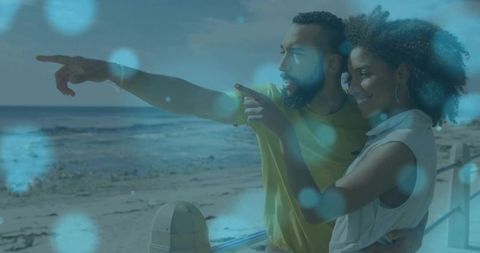 Couple Enjoys Ocean View Pointing Enthusiastically