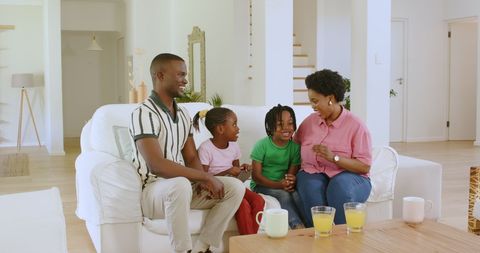 African Family Sharing Announcement on Cozy Couch