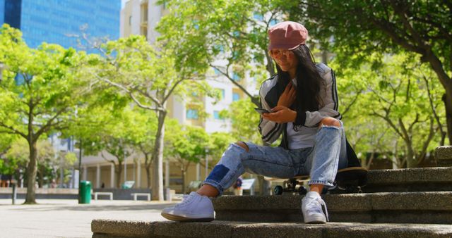 Urban Young Woman Relaxing with Smartphone in City Park - Download Free Stock Images Pikwizard.com