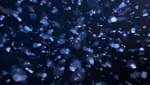 Dynamic Blue Glowing Bokeh Particles in Cosmic Digital Space