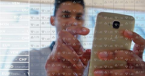 Analyst Reviewing Currency Exchange Rates on Smartphone