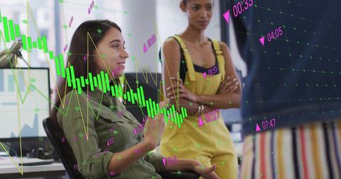 Diverse Business Team Discussing Financial Data and Technology