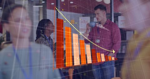 Diverse Team Analyzing Digital Data Visualization in Office